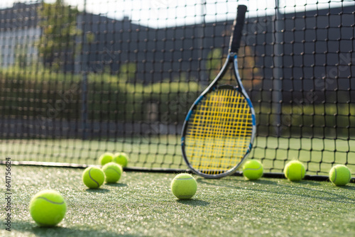 Tennis Racket and Balls on Court