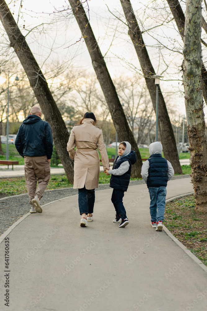 Happy family on a walk in the park Happy family on a walk in the park