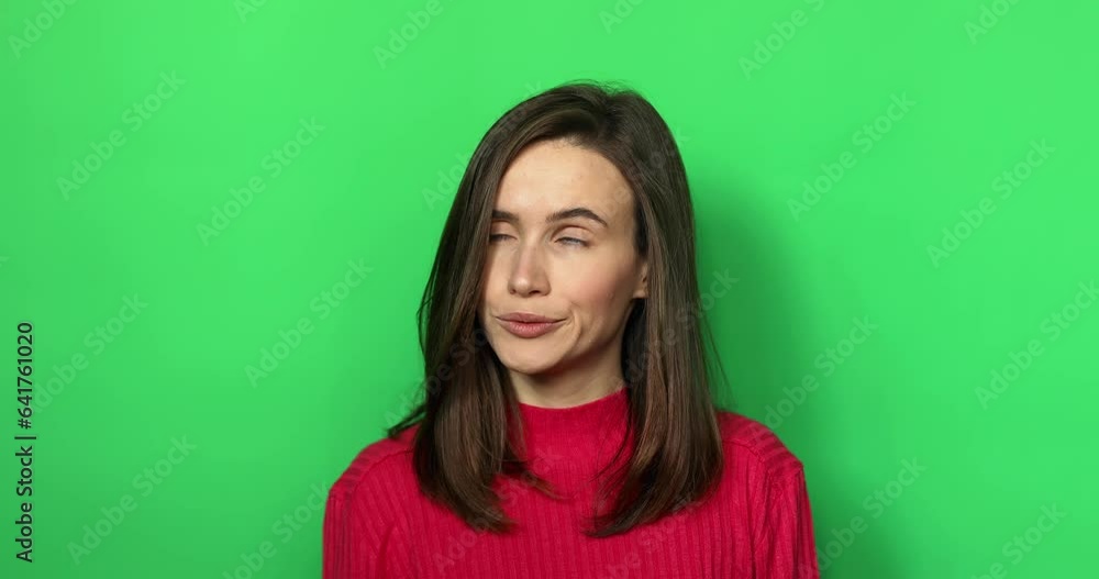 A displeased young woman rolls her eyes isolated over green chroma key background. Caucasian lady in displeasure, she is tired of situation, thinks how cant you still not understand. A displeased young woman rolls her eyes isolated over green chroma key background. Caucasian lady in displeasure, she is tired of situation, thinks how cant you still not understand.