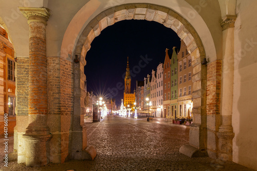 View of the tower above the old medieval town hall at the long market at night, Gdansk. Poland. photo