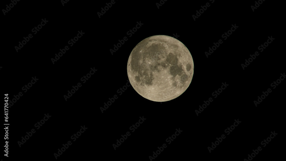 Full moon photo. Blue moon photo taken with a tele lens. Full moon photo. Blue moon photo taken with a tele lens.