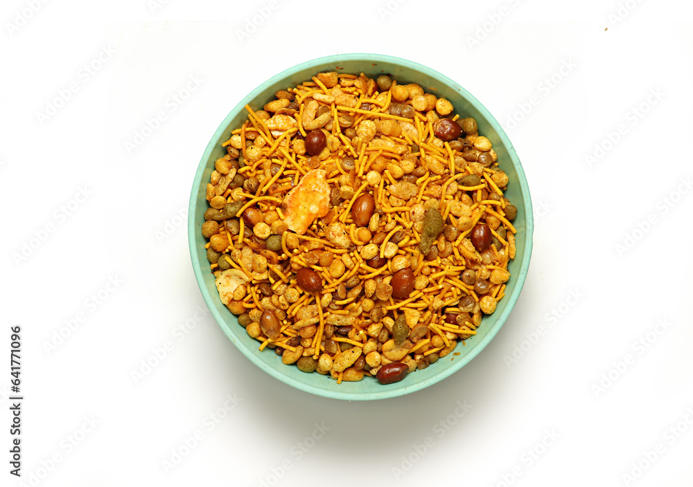 Indian Namkeen Snacks served in ceramic bowl Indian traditional Namkeen on a white background, Food Mixture,Navratna Mix Namkeen Also Know as Nimco, Namkin, Mixture,chiwda, Nimko ( Top View) Indian Namkeen Snacks served in ceramic bowl Indian traditional Namkeen on a white background, Food Mixture,Navratna Mix Namkeen Also Know as Nimco, Namkin, Mixture,chiwda, Nimko ( Top View)