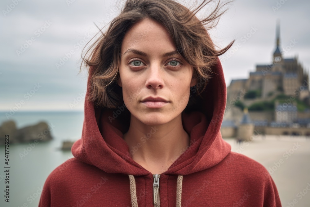 Close-up portrait photography of a content girl in her 40s wearing a zip-up fleece hoodie at the mont saint-michel in normandy france. With generative AI technology Close-up portrait photography of a content girl in her 40s wearing a zip-up fleece hoodie at the mont saint-michel in normandy france. With generative AI technology