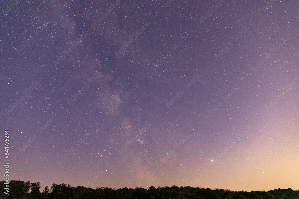 Stars sky with Milky Way in front of a forest Stars sky with Milky Way in front of a forest