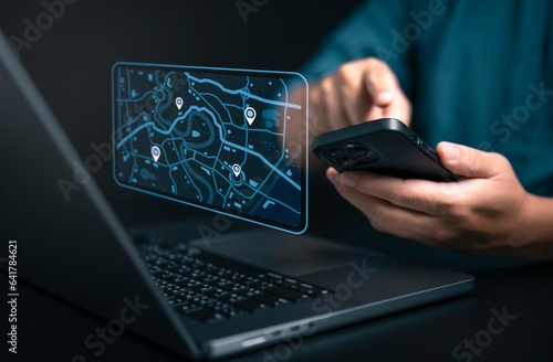 Businessman using smartphone and computer to search map with geolocation points. Synchronize GPS, Mark destination trip app and find business places by online map system, Exploring target location.