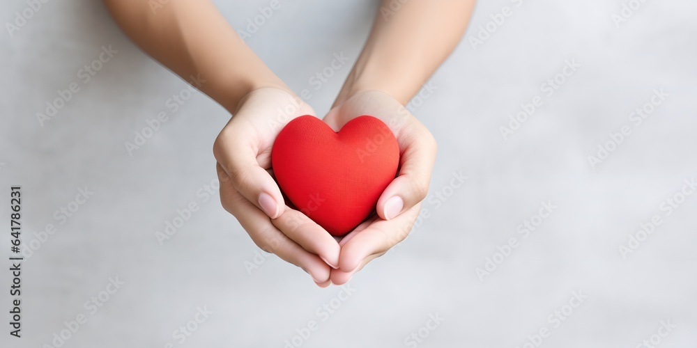 Obraz premium Red heart in hand, generative ai