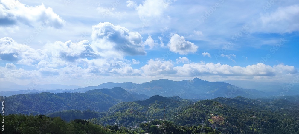 landscape with clouds mountain blue sky green forest
