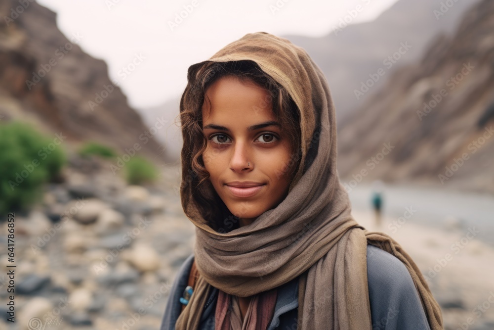 Photography in the style of pensive portraiture of a grinning girl in her 20s wearing a water-resistant gilet at the socotra island in yemen. With generative AI technology Photography in the style of pensive portraiture of a grinning girl in her 20s wearing a water-resistant gilet at the socotra island in yemen. With generative AI technology