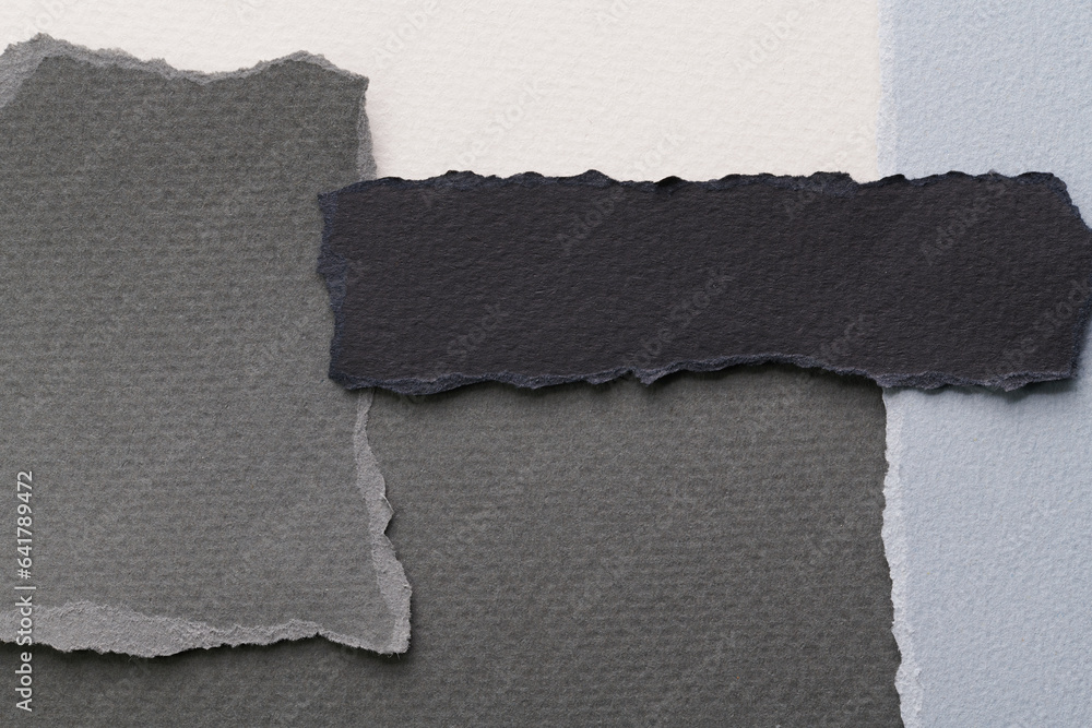 Art collage of pieces of ripped paper with torn edges. Sticky notes collection black gray white colors, shreds of notebook pages. Abstract background. Art collage of pieces of ripped paper with torn edges. Sticky notes collection black gray white colors, shreds of notebook pages. Abstract background.