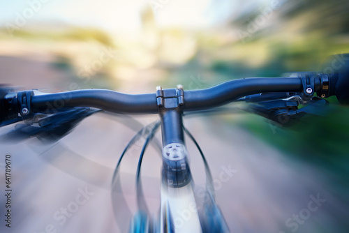 Fast, blur and a bicycle in nature for cycling, fitness or training for a marathon. Speed, road and a bike in motion for sports, triathlon or exrcise in the countryside while moving for cardio