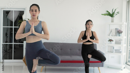 two women doing exercise yoga