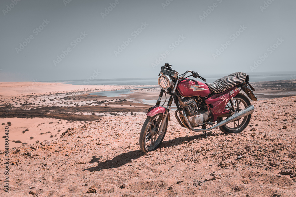 Motorcycle in Fayoum Oasis Desert Landscape, Egypt Motorcycle in Fayoum Oasis Desert Landscape, Egypt