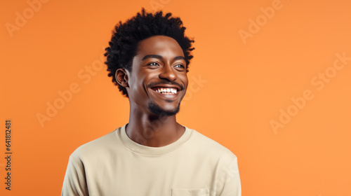 African male smiling on the pastel background