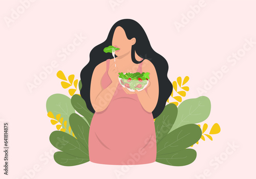 Pregnant woman eats salad
