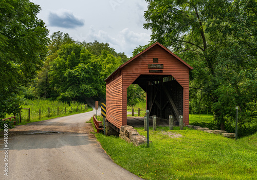 Dents Run Covered Bridge is a historic covered bridge located near Laurel Point, Monongalia County, West Virginia. Kingpost truss construction in 1889