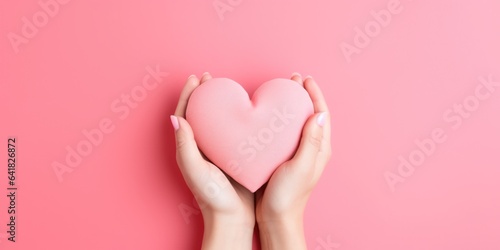 Young women hands holding paper pink heart on pink background, health care, donate and family insurance concept, world heart day, world health day, Valentine's day, generative ai