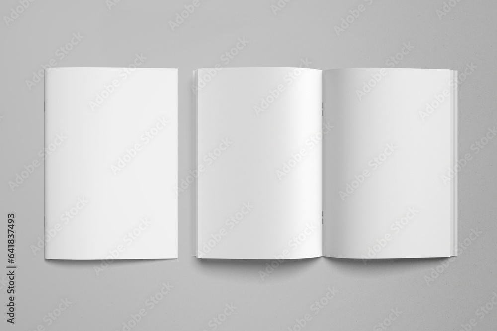 Open and closed blank Magazine / Brochure Catalog on grey background, top view. Mock up for design Open and closed blank Magazine / Brochure Catalog on grey background, top view. Mock up for design