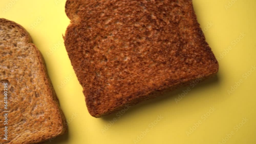 Three isolated toasted bread slices. They got different toasting points. Yellow background Three isolated toasted bread slices. They got different toasting points. Yellow background