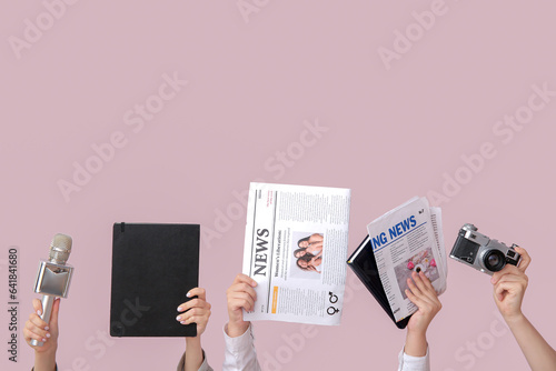 Female hands with newspaper...