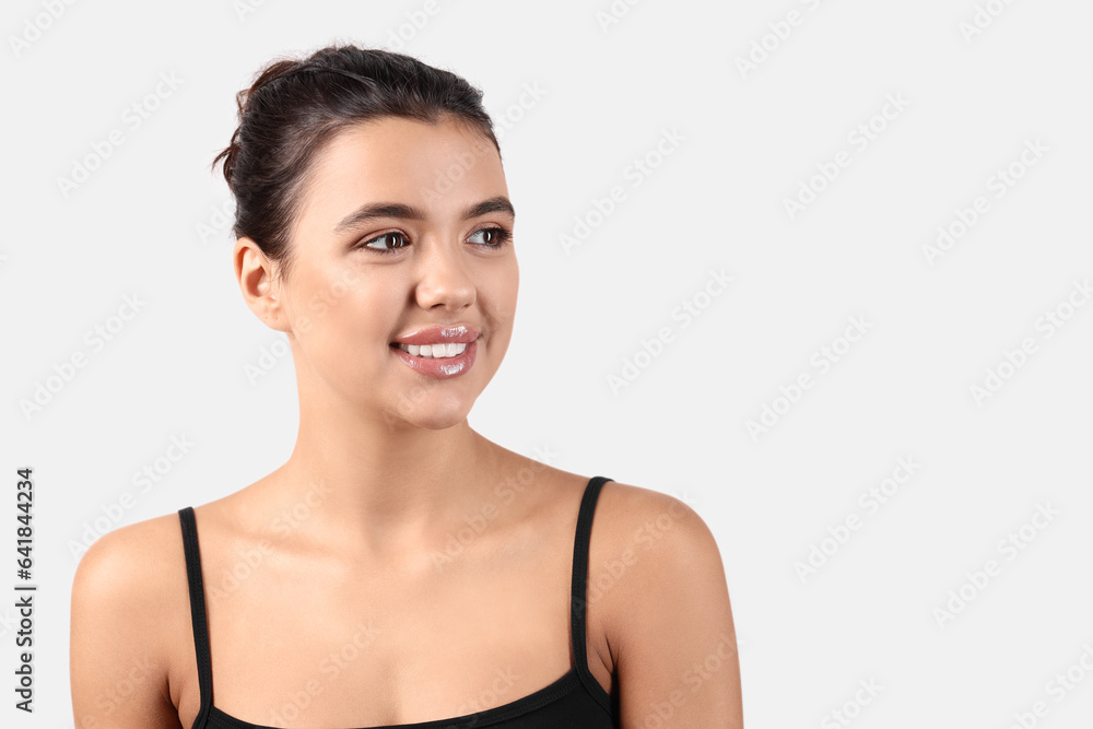 Young woman with beautiful lips on light background, closeup Young woman with beautiful lips on light background, closeup