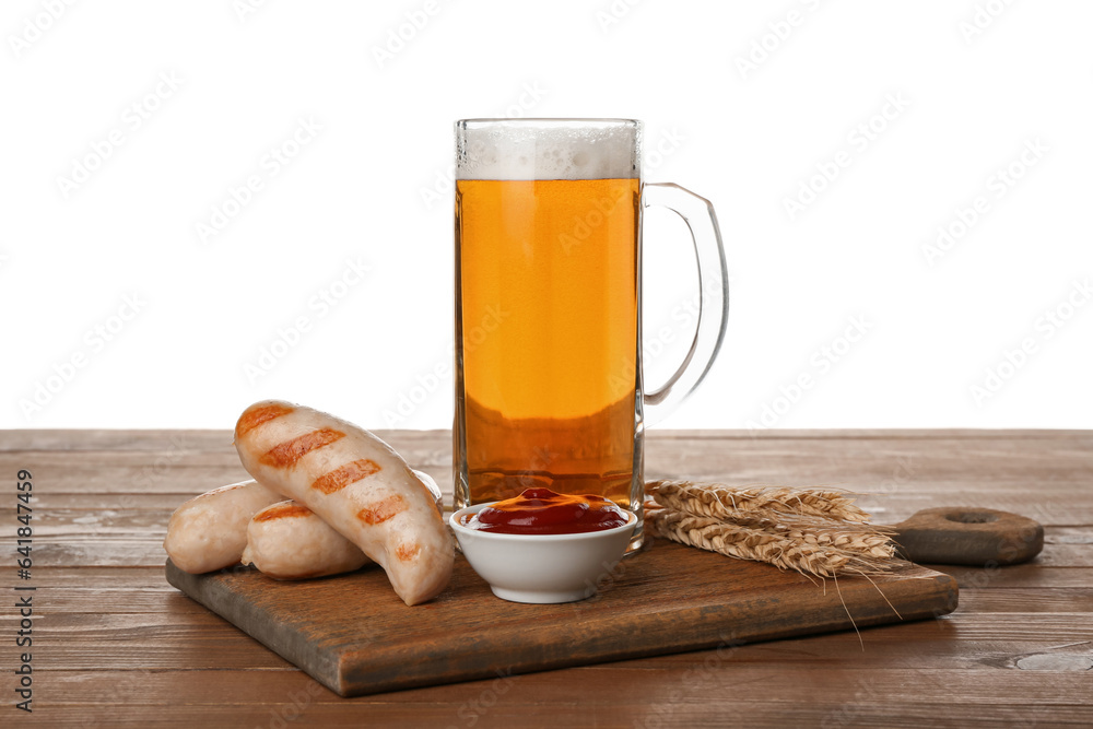 Wooden board with mug of cold beer sausages and sauce on table against white background. Oktoberfest celebration Wooden board with mug of cold beer sausages and sauce on table against white background. Oktoberfest celebration