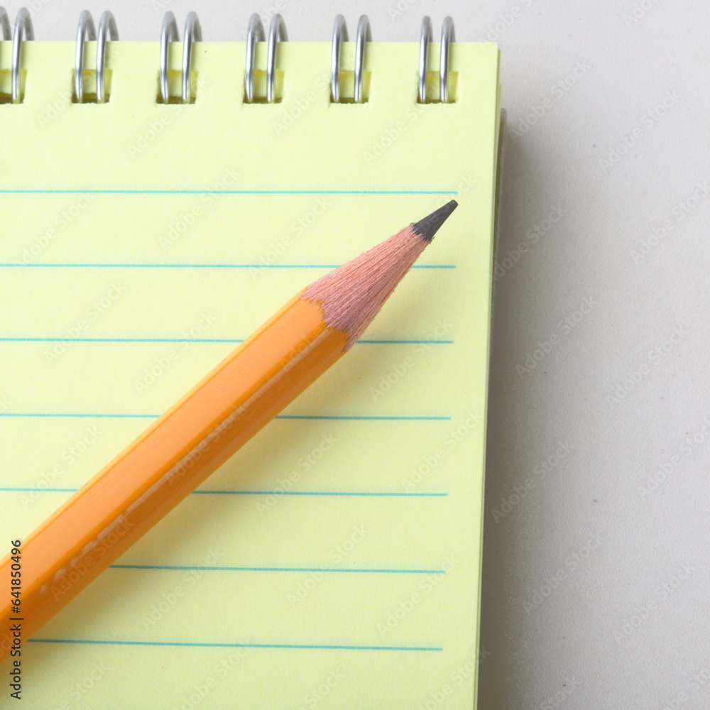 The notepad and red pencil The notepad and red pencil