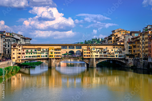 Ponte Vecchio  old Bridge  in Florence  Italy. This medieval stone bridge that spans river Arno  consists of three segmental arches and it has always hosted shops and merchants.