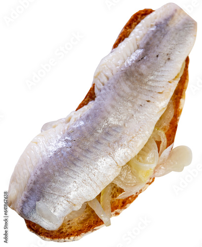 Delicious sandwich with slice of lightly salted herring fillet garnished with sweetish pickled onions. Popular European cuisine. Isolated over white background photo