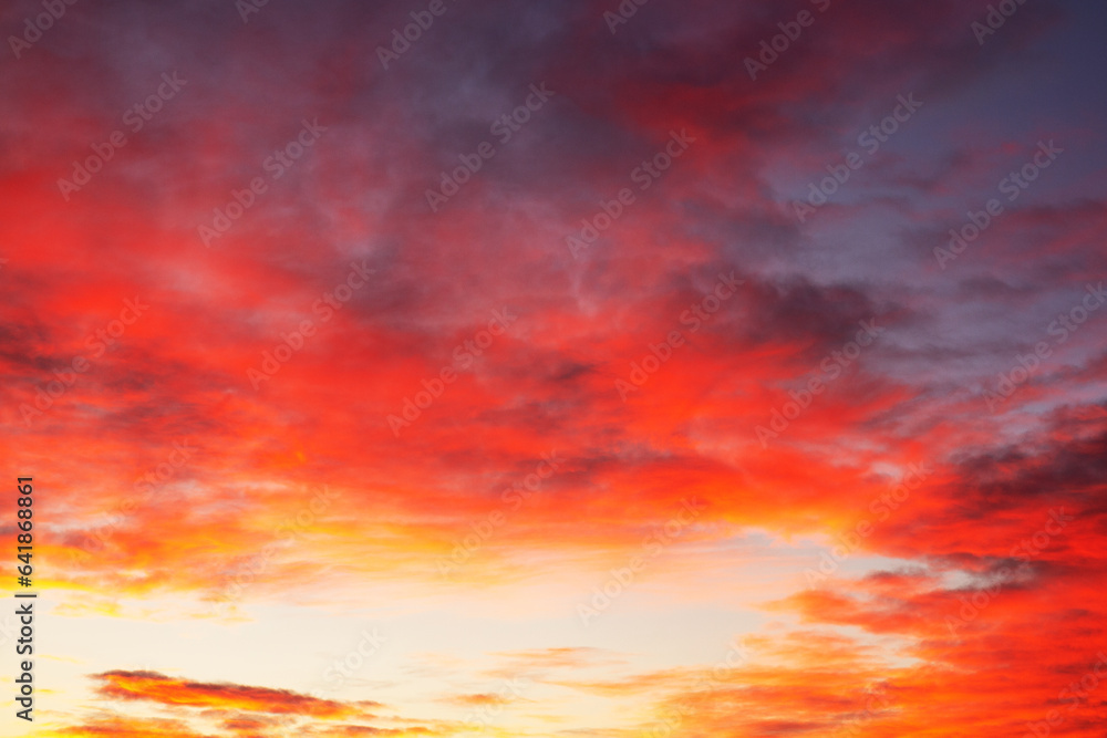 Textured background of beautiful sunset. Amazing red and yellow sunset with 