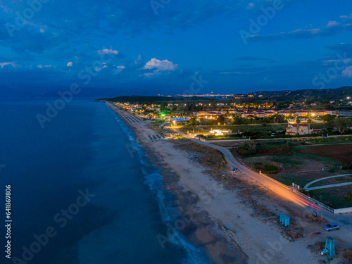 Aerial drone view of almyros beach by night in north corfu,Greece