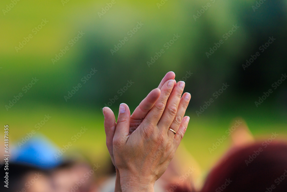 Hands of clapping or applauding people. Background with selective focus and copy space Hands of clapping or applauding people. Background with selective focus and copy space