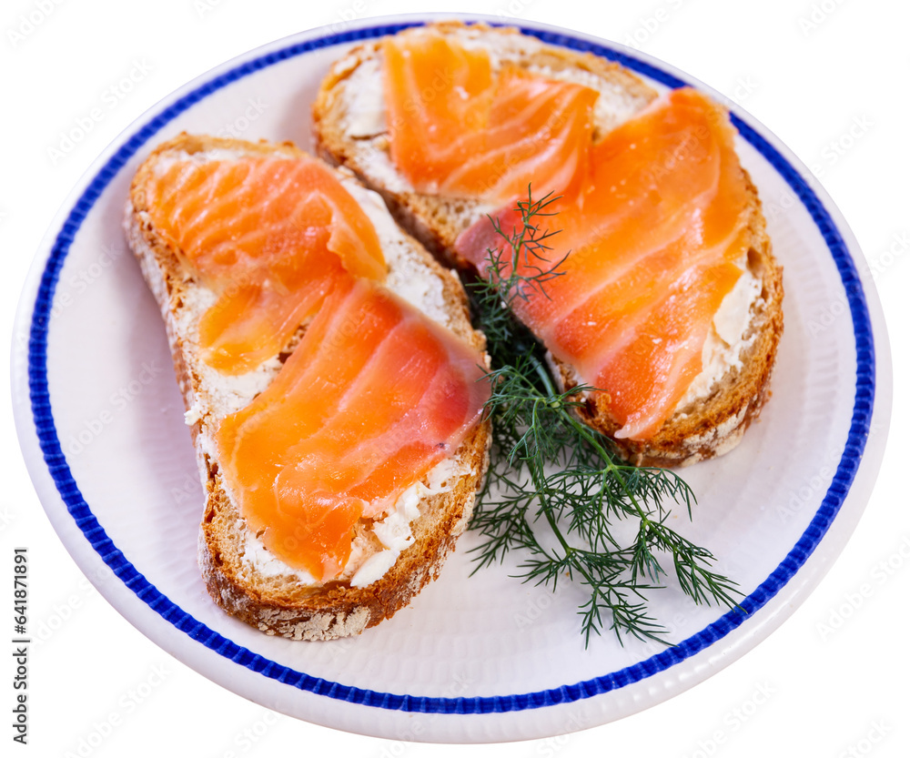Round plate with homemade light snack - toast, crispy salmon sandwiches decorated with dill. Isolated over white background