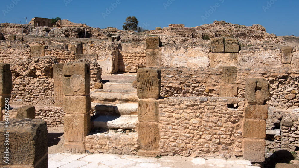 Stone walls and foundations in the Roman bath area of the Roman ruins at Oudna, outside of Tunis, Tunisia