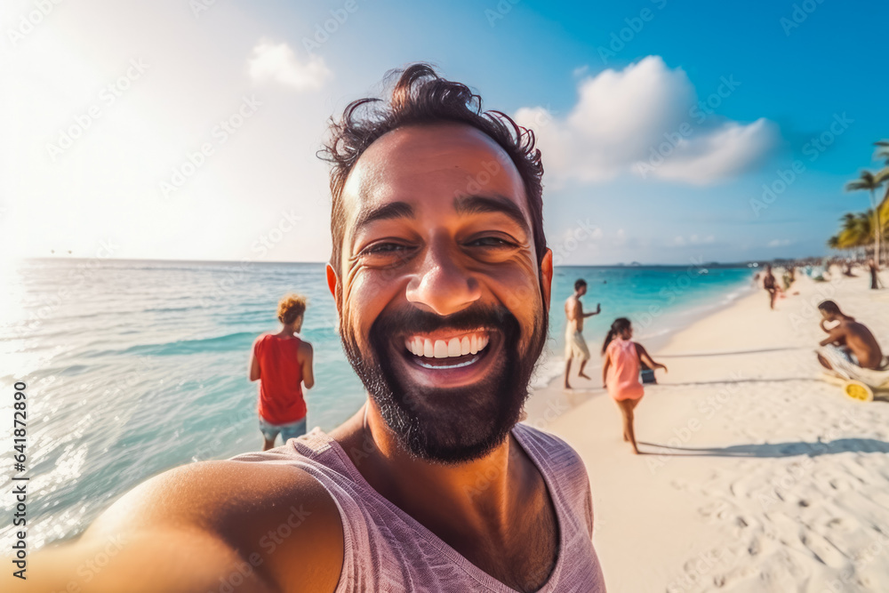 Happy young indian man enjoying a day on the beach while smiling and making a picture - obrazy, fototapety, plakaty 