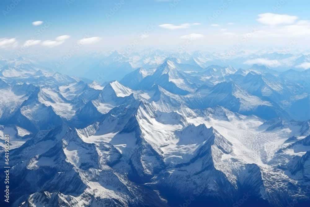 Fototapeta premium Majestic Peaks and Serene Valleys: A Breathtaking Aerial Perspective of Pristine Mountain Wilderness