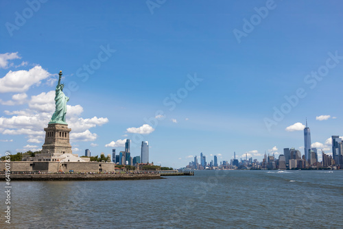 A view of the Statue of Liberty as seen from the ferry heading to Liberty Island on a bright sunny day. © John