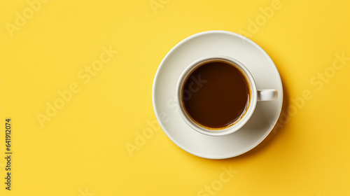 A Cup of Coffee on a Saucer Resting on a Vibrant Yellow Background with Chic Simplicity