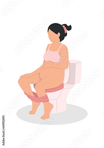 Pregnant woman sitting on the toilet