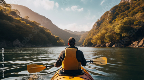 A Person Immersed in an Eco-Friendly Activity, Finding Bliss While Kayaking Amidst Serene Waters and Lush Greenery © Linus