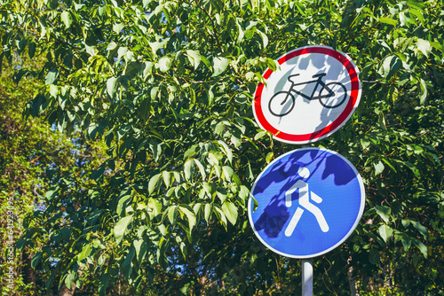 Bicycle traffic sign is prohibited and pedestrian traffic is allowed mounted on a pole