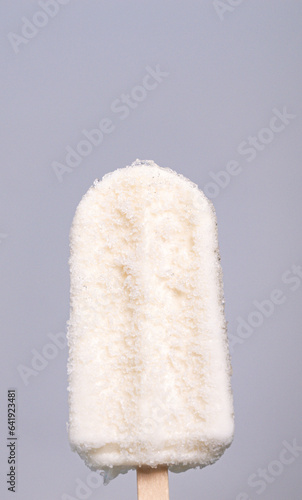 Vertical front view CU, Coconut milk flavored ice cream sticks on a white background.