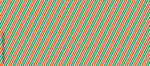 Red and green Christmas seamless pattern. Candy cane diagonal stripes background. Repeating decoration wallpaper. Winter holidays lines backdrop. Xmas peppermint gift wrapping print. Vector