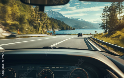 POV of driver capturing traffic by the car on a scenic road