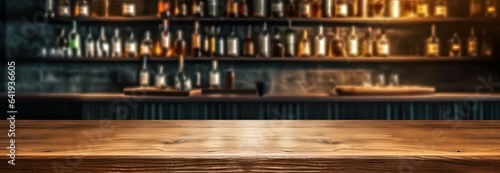 Stylish interior on blurred background. Vintage vibes. Rustic cafe with empty wooden table for place product. Bottles and blurs. Abstract display