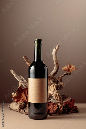 Bottle of red wine with a composition of old wood.