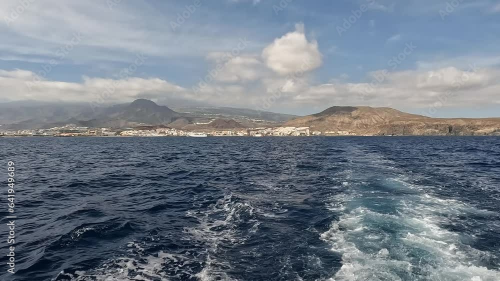 Whale watching boat travelling away from the harbour in Tenerife. Whale watching boat travelling away from the harbour in Tenerife.
