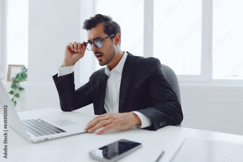 Man frustration person thinking business desk laptop sitting expression working glasses tired office manager Man frustration person thinking business desk laptop sitting expression working glasses tired office manager