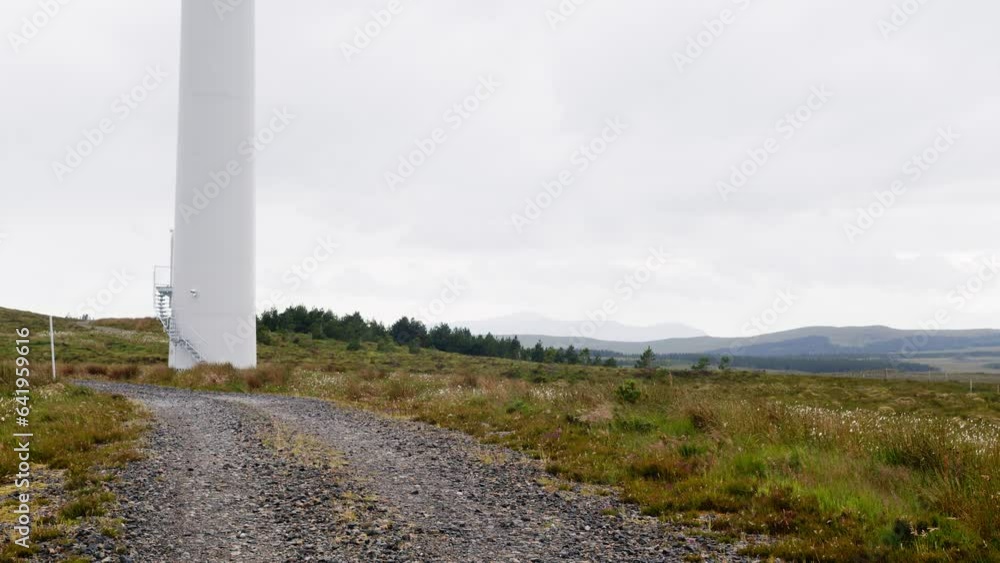 Dynamic shot of a wind turbine spinning its blades on a gusty day. Dynamic shot of a wind turbine spinning its blades on a gusty day.