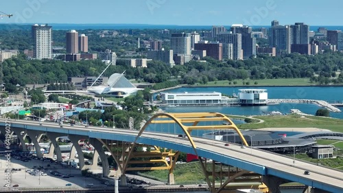 Daniel W. Hoan Memorial Bridge in Milwaukee, Wisconsin. Aerial shot of famous bridge and art museum in background on Lake Michigan. Long zoom lens. photo