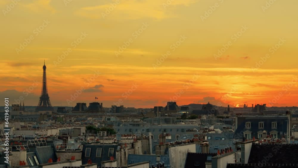 Sunset overlooking French rooftops and the Eiffel Tower Sunset overlooking French rooftops and the Eiffel Tower